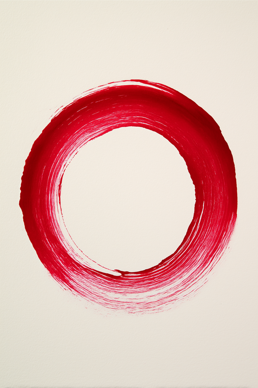 Red zen enso circle brushstroke on white background