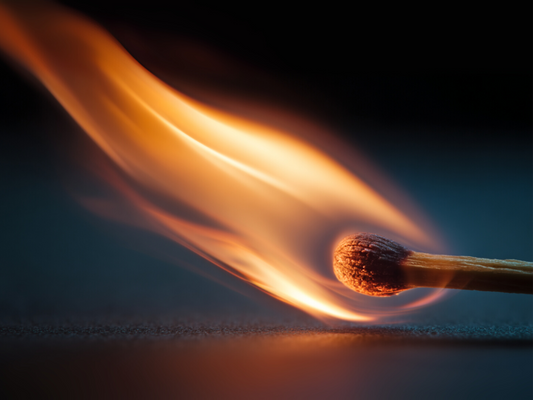 Close-up of match igniting with dynamic flame